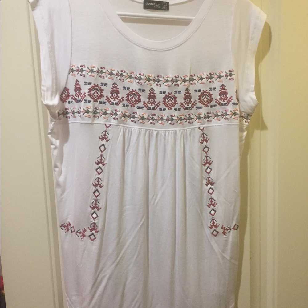 White top with floral detail